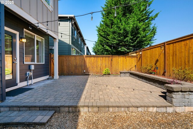 16085 SE Kingbird Dr, Clackamas, OR 97015 - fenced backyard featuring a patio area