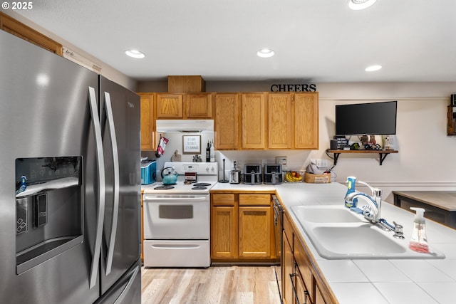 816 SW Chablis Ct, Dundee, OR 97115 - kitchen featuring appliances with stainless steel finishes, under cabinet range hood, a sink, tile countertops, and light wood finished floors