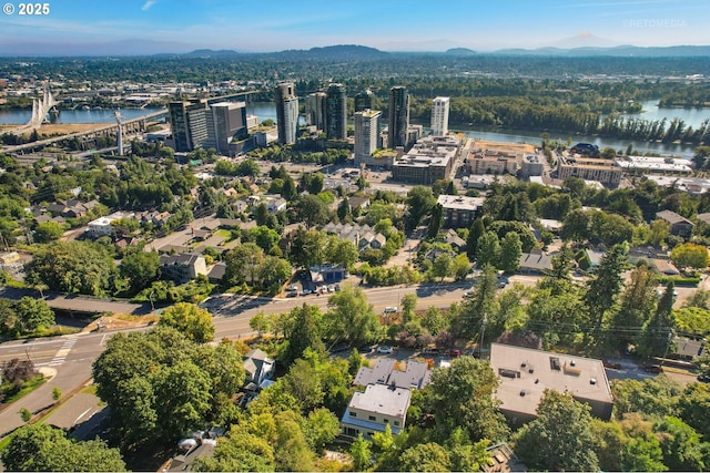 aerial view of property's location featuring a water and mountain view