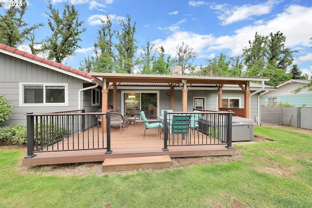 back of property with a deck and outdoor dining space