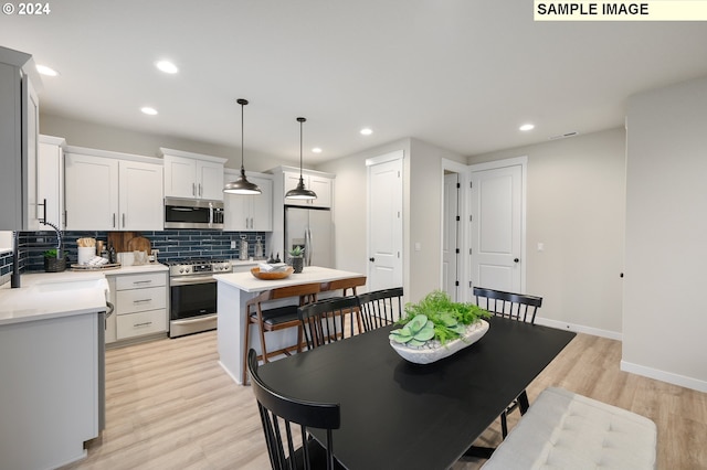 dining area with light hardwood / wood-style flooring