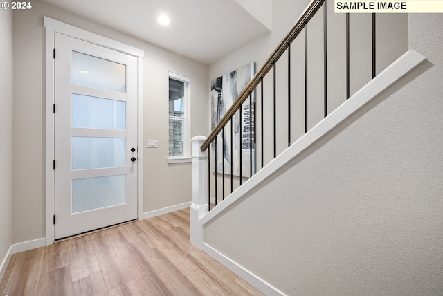 entryway with light hardwood / wood-style flooring