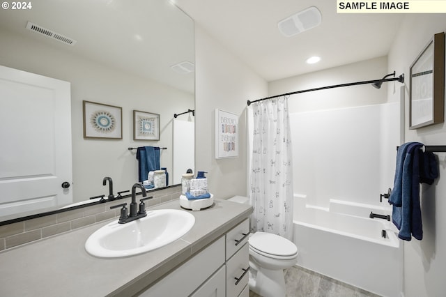 full bathroom with vanity, toilet, and shower / tub combo