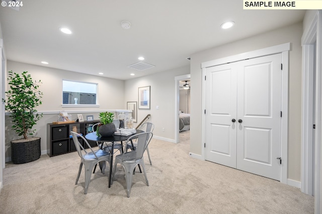 view of carpeted dining space