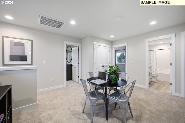 view of carpeted dining area