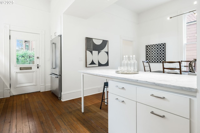 1720 NW Hoyt St, Portland, OR 97209 - office area featuring dark wood-style flooring and baseboards