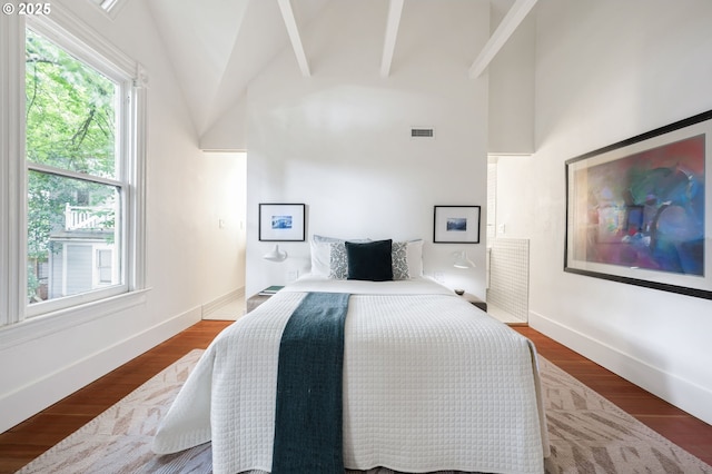 1720 NW Hoyt St, Portland, OR 97209 - bedroom featuring high vaulted ceiling and wood finished floors