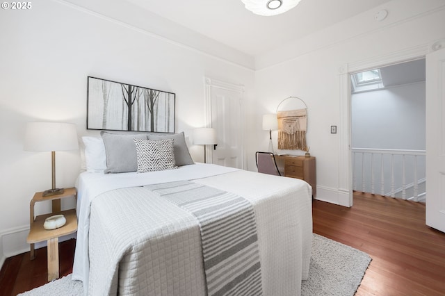 1720 NW Hoyt St, Portland, OR 97209 - bedroom featuring wood finished floors and baseboards