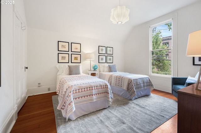 1720 NW Hoyt St, Portland, OR 97209 - bedroom with wood finished floors and vaulted ceiling