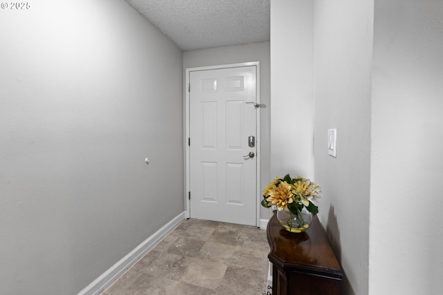 entryway featuring a textured ceiling