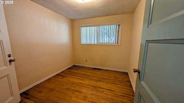 4845 Elizabeth St N, Keizer, OR 97303 - spare room featuring wood finished floors, a textured ceiling, and baseboards