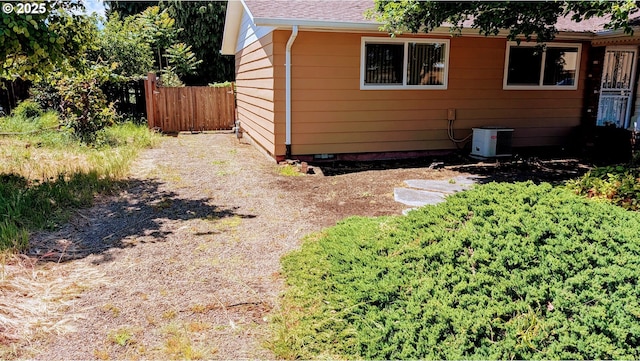4845 Elizabeth St N, Keizer, OR 97303 - view of property exterior with central AC and a shingled roof