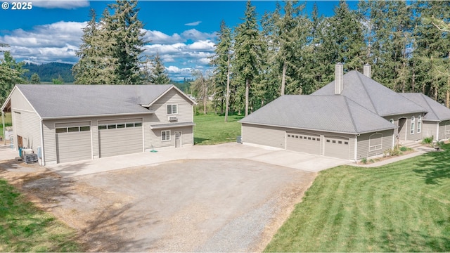34103 Adler Ln, Creswell, OR 97426 - detached garage featuring concrete driveway and central AC