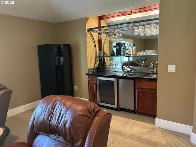 34103 Adler Ln, Creswell, OR 97426 - indoor wet bar featuring wine cooler, refrigerator, light colored carpet, and baseboards