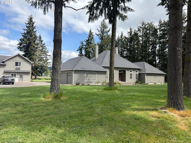 34103 Adler Ln, Creswell, OR 97426 - view of front facade featuring a chimney, a garage, driveway, and a front lawn