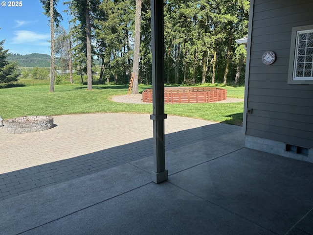 34103 Adler Ln, Creswell, OR 97426 - view of patio / terrace with an outdoor fire pit