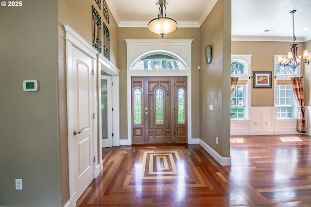 34103 Adler Ln, Creswell, OR 97426 - entrance foyer featuring a chandelier, crown molding, a high ceiling, wood finished floors, and baseboards