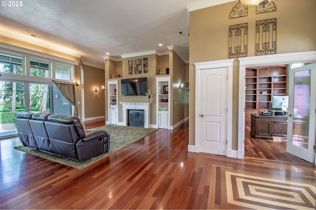 34103 Adler Ln, Creswell, OR 97426 - living area featuring ornamental molding, a fireplace, baseboards, built in features, and wood finished floors