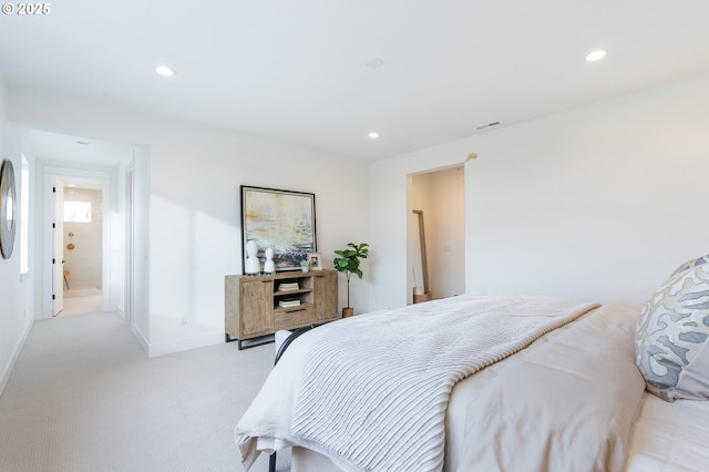 bedroom with visible vents, recessed lighting, light colored carpet, and baseboards