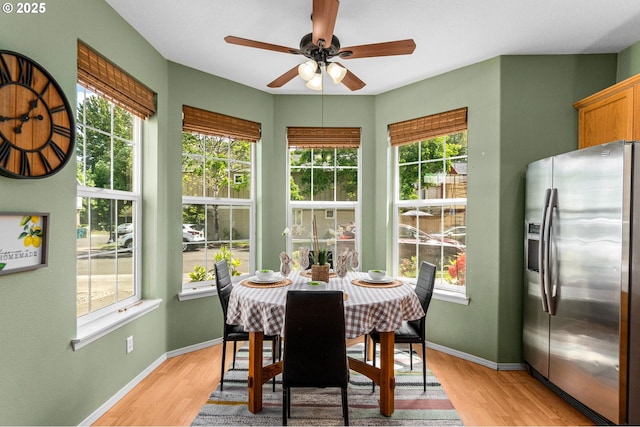 6073 SW 205th Ave, Beaverton, OR 97078 - dining space with ceiling fan, healthy amount of natural light, light wood-type flooring, and baseboards
