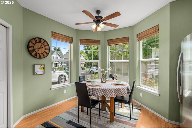 6073 SW 205th Ave, Beaverton, OR 97078 - dining room featuring plenty of natural light, wood finished floors, ceiling fan, and baseboards