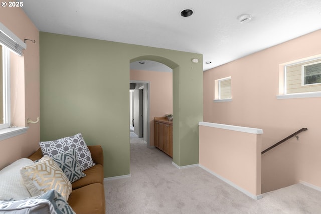 6073 SW 205th Ave, Beaverton, OR 97078 - hall with an upstairs landing, light colored carpet, arched walkways, and baseboards