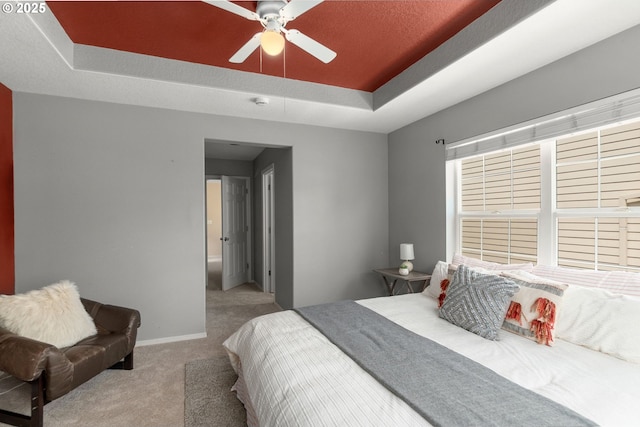 6073 SW 205th Ave, Beaverton, OR 97078 - carpeted bedroom featuring a raised ceiling, baseboards, and ceiling fan