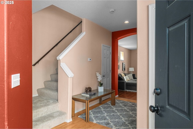 6073 SW 205th Ave, Beaverton, OR 97078 - foyer featuring arched walkways, wood finished floors, stairs, recessed lighting, and baseboards