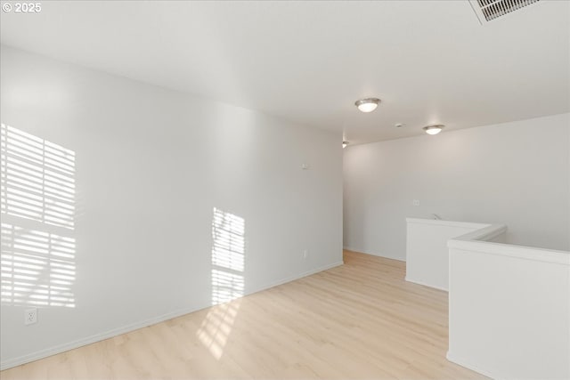 unfurnished room featuring light wood-type flooring