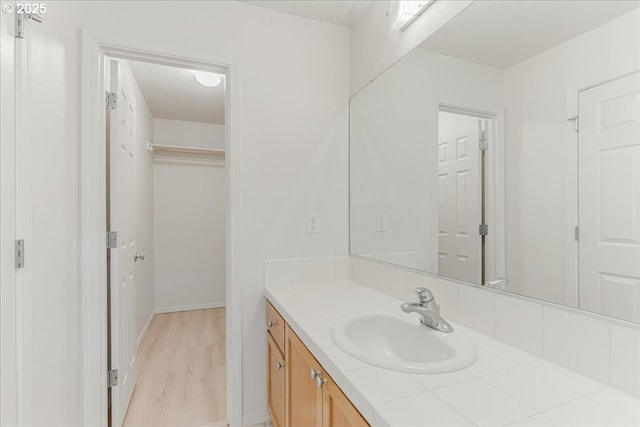 bathroom featuring hardwood / wood-style flooring and vanity