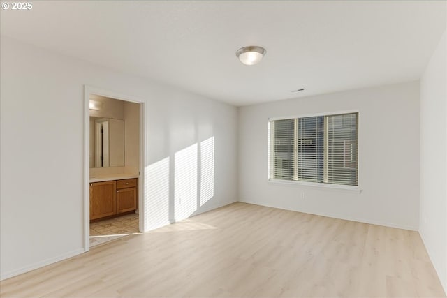 empty room with light wood-type flooring