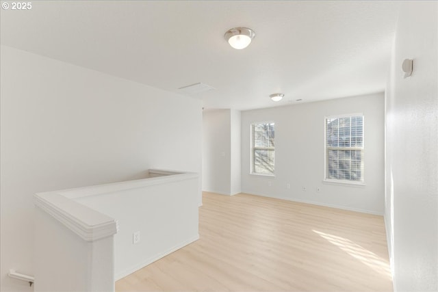 unfurnished room with light hardwood / wood-style flooring