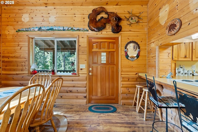 1470 E Willis Creek Rd, Winston, OR 97496 - dining room featuring rustic walls, wood-type flooring, and wood walls
