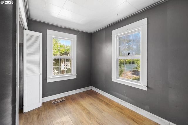 15016 NE Klickitat St, Portland, OR 97230 - spare room featuring wood finished floors and baseboards