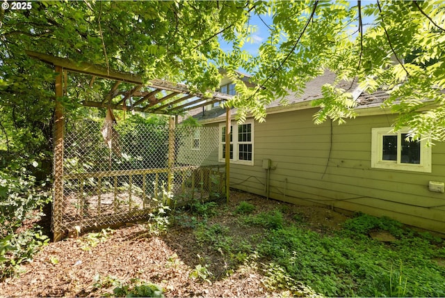 15016 NE Klickitat St, Portland, OR 97230 - view of side of home with a pergola and roof with shingles