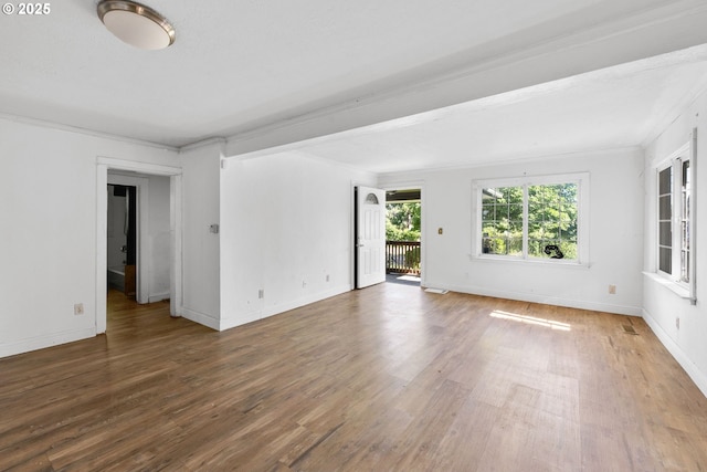 15016 NE Klickitat St, Portland, OR 97230 - empty room featuring wood finished floors, crown molding, and baseboards