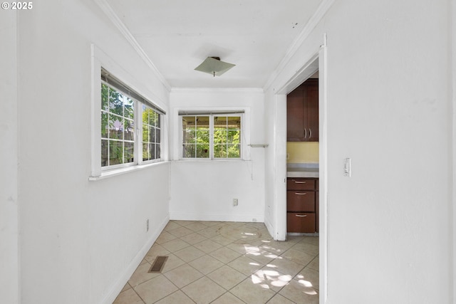 15016 NE Klickitat St, Portland, OR 97230 - spare room featuring ornamental molding, baseboards, and light tile patterned floors