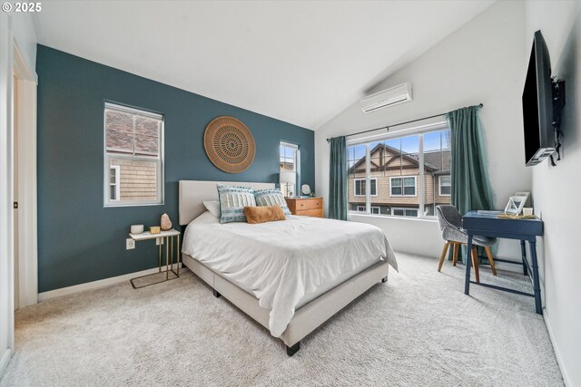 carpeted bedroom with baseboards, a wall mounted AC, and vaulted ceiling