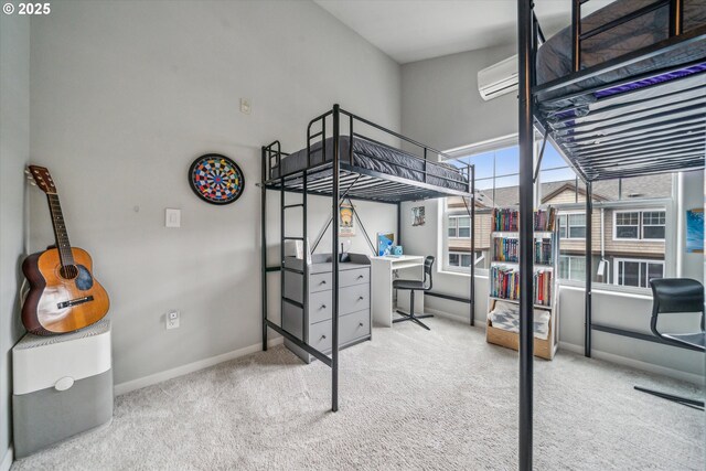 carpeted bedroom with baseboards and a wall mounted air conditioner