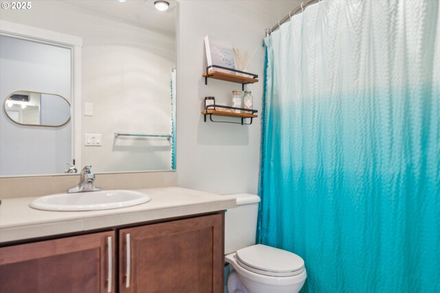 bathroom with vanity and toilet
