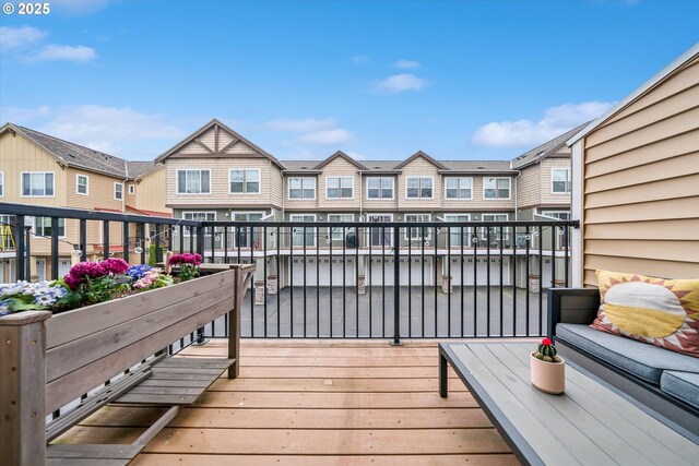wooden deck with a residential view