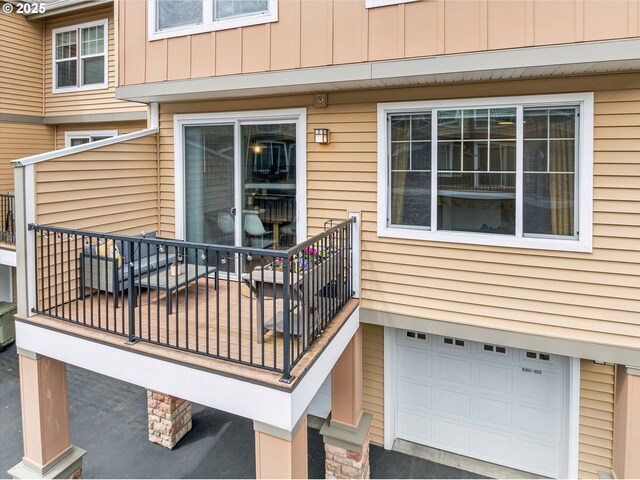 wooden terrace featuring an attached garage