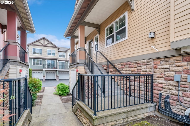 property entrance featuring stone siding