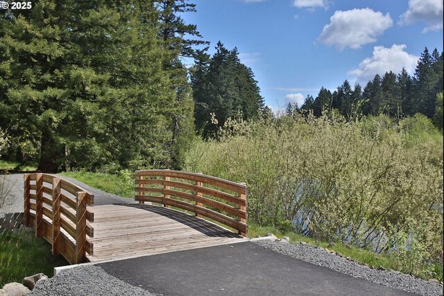 view of gate featuring a wooded view