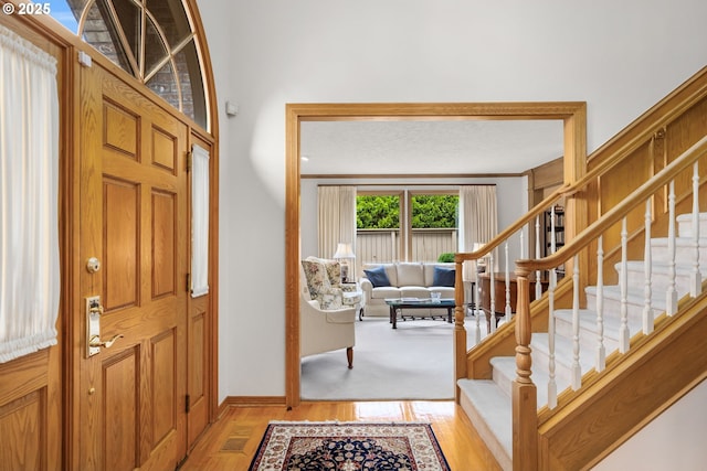 14479 Pfeifer Dr, Lake Oswego, OR 97035 - entryway with stairway and light wood-type flooring
