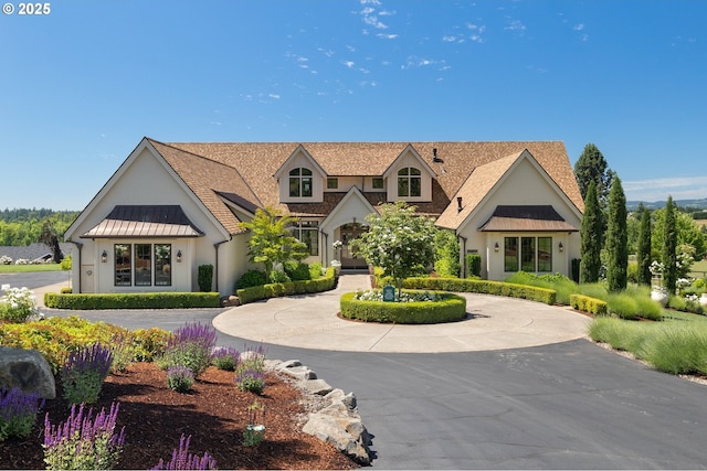 26817 SW Cade Ln, West Linn, OR 97068 - view of front of home with a standing seam roof, metal roof, and stucco siding