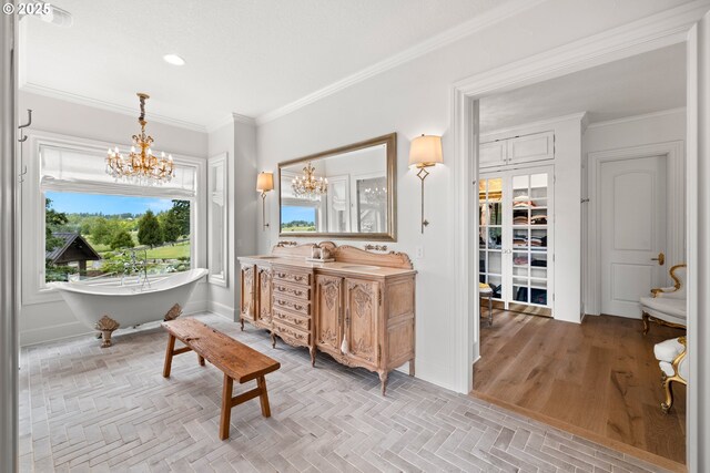 26817 SW Cade Ln, West Linn, OR 97068 - full bathroom featuring a chandelier, ornamental molding, vanity, a soaking tub, and recessed lighting