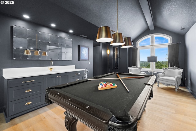 26817 SW Cade Ln, West Linn, OR 97068 - game room with light wood finished floors, billiards table, a sink, and a textured ceiling