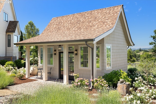 26817 SW Cade Ln, West Linn, OR 97068 - view of front of house featuring roof with shingles and covered porch