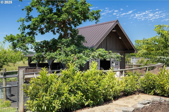26817 SW Cade Ln, West Linn, OR 97068 - view of property exterior with board and batten siding, metal roof, and a standing seam roof